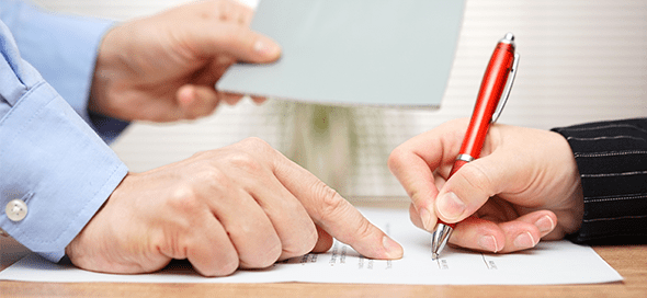 Person instructing another person where to sign a document