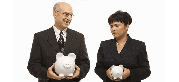 Man holding a large piggy bank and woman holding a small piggy bank